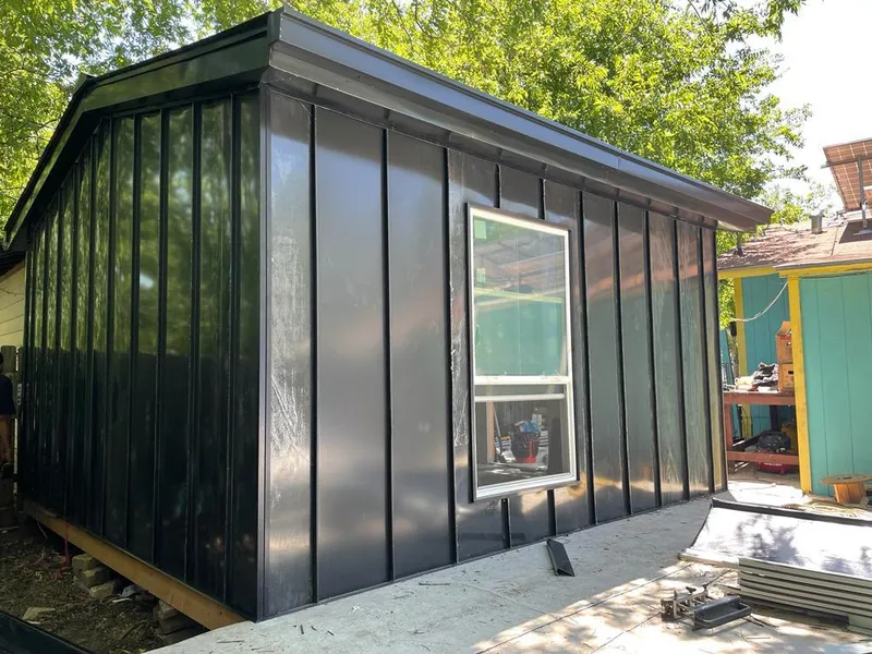 Black standing seam metal wall panels for Roof Inspection in North Providence